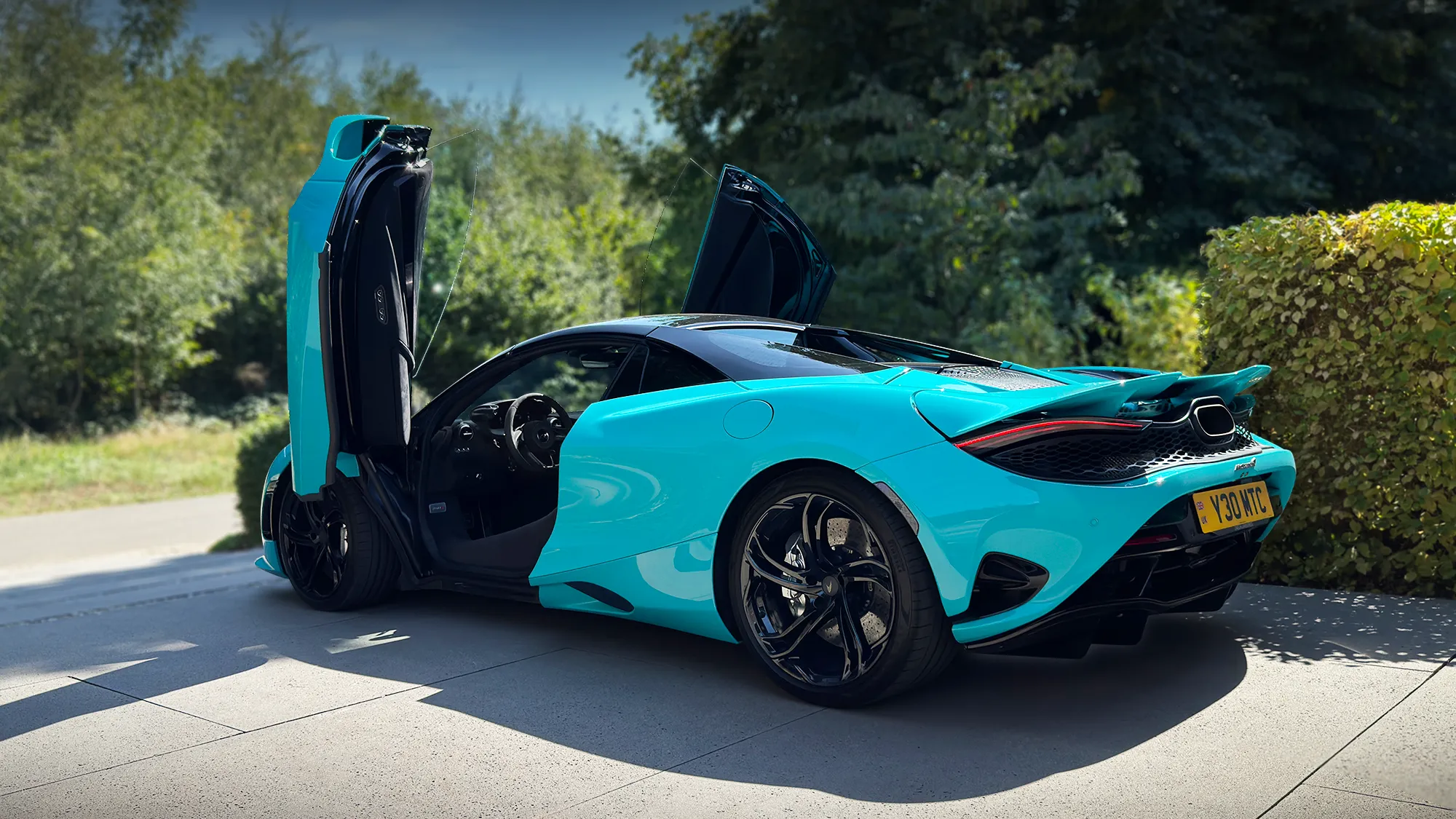 McLaren 750S Spider in Tokyo Cyan with dihedral doors open